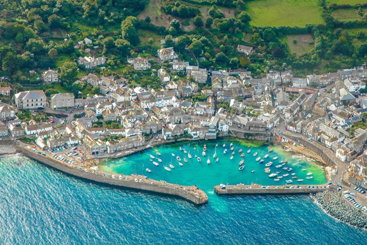 Stunning aerial shot of Mousehole village and harbour taken from a drone.