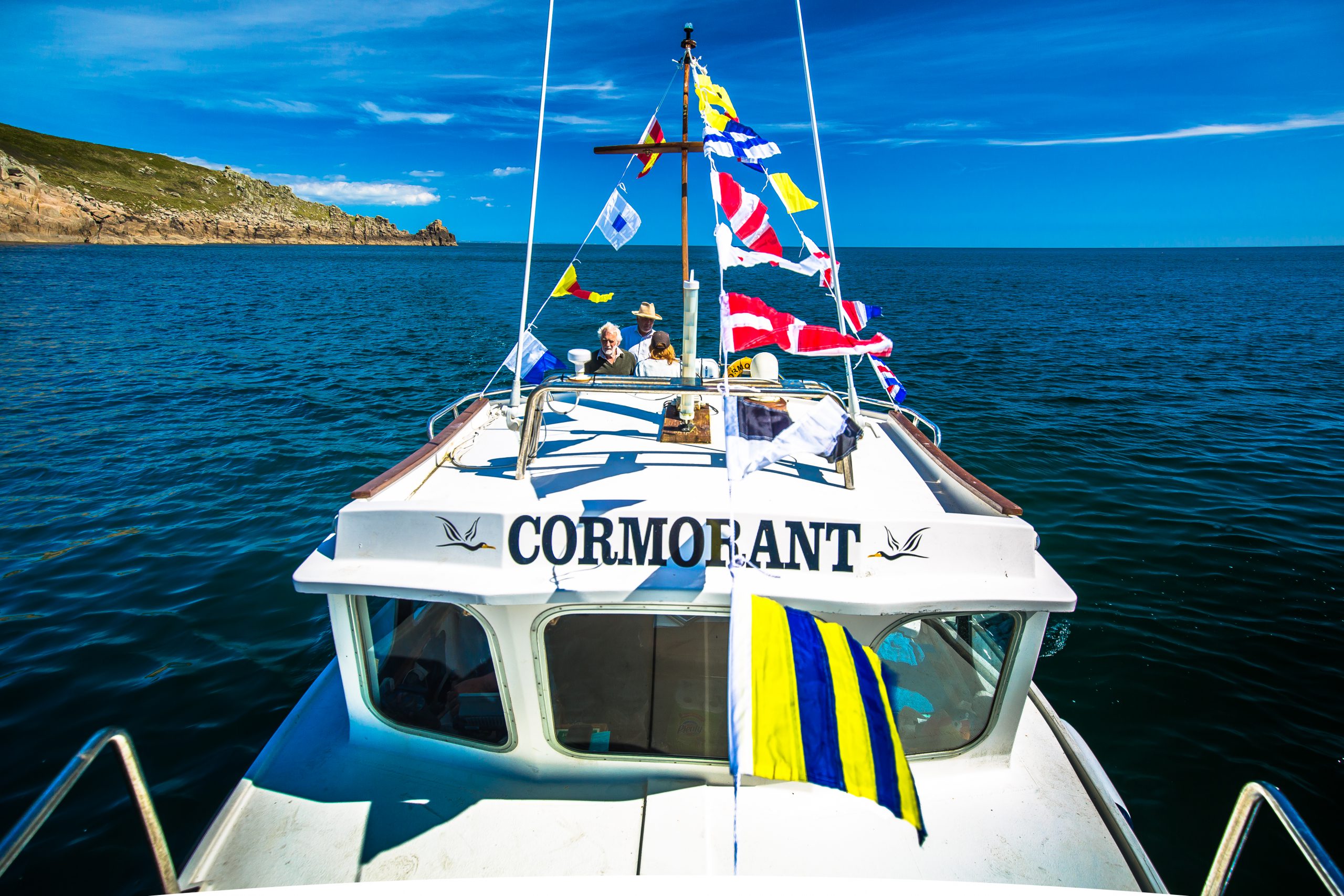 The Cormorant on a coastal cruise in the summer sunshine.