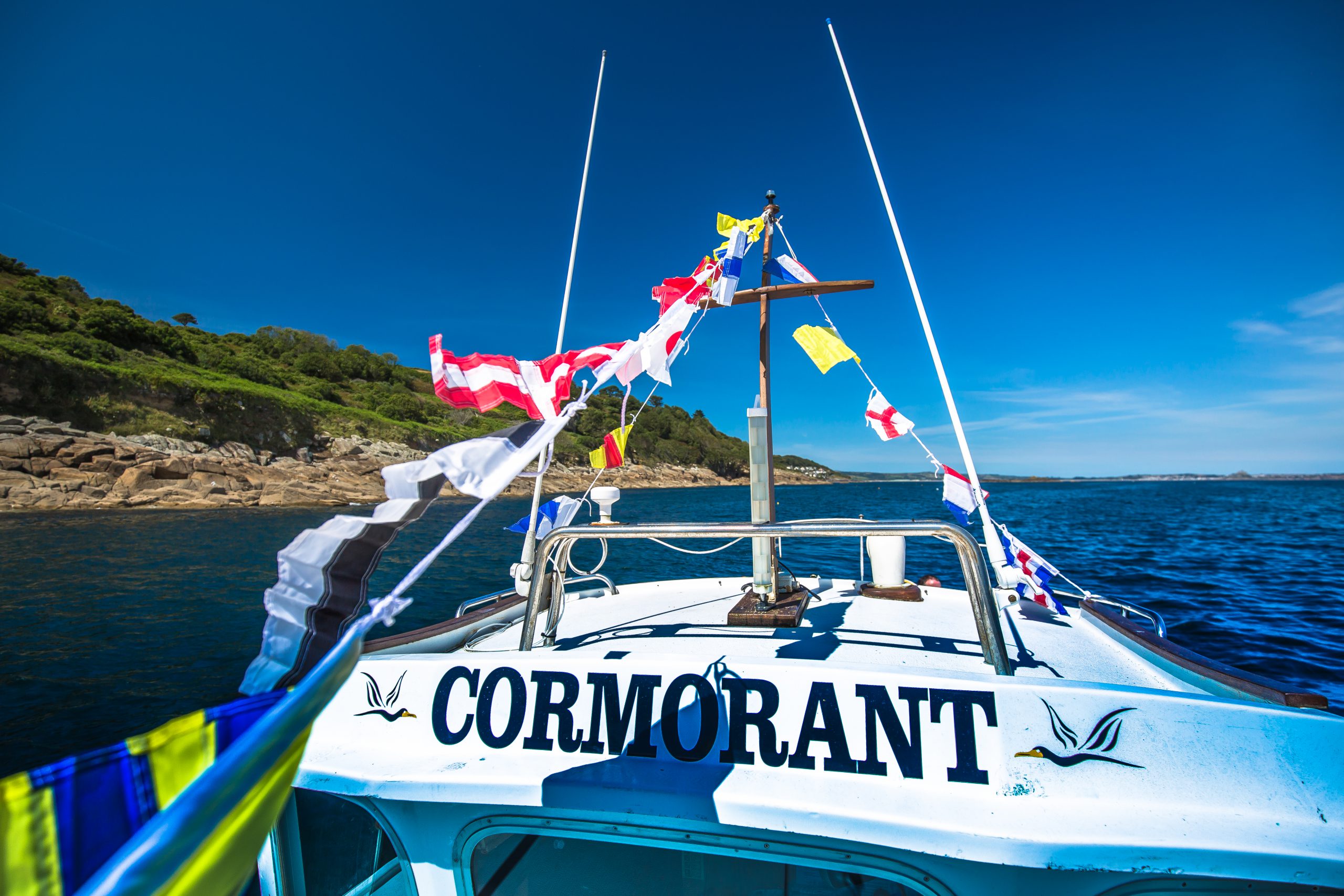 The Cormorant chugging down the spectacular Cornish coastline.